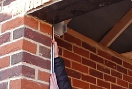 Behind Fit: roller box mounted behind the lintel, inside the garage