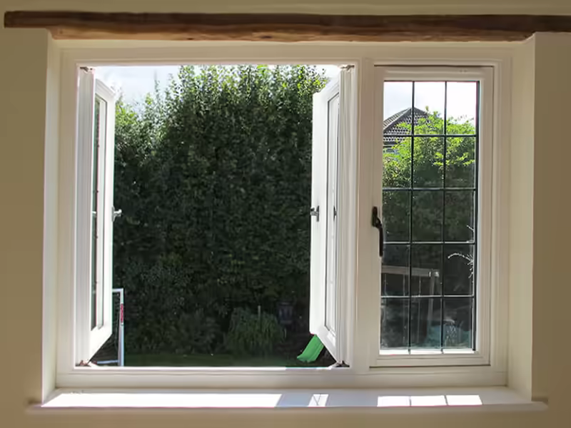 French-opening white windows with one sash open